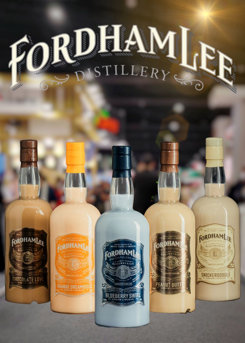 A Lineup Of Fordham Lee Distillery’s Premium Cream Liqueurs, Including Chocolate Love, Orange Dreamsicle, Blueberry Swirl, Peanut Butter, And Snickerdoodle, Displayed At The Howard County Spring Craft Show. The Festive Indoor Market Setting Highlights The Handcrafted Quality Of These Indulgent Spirits.